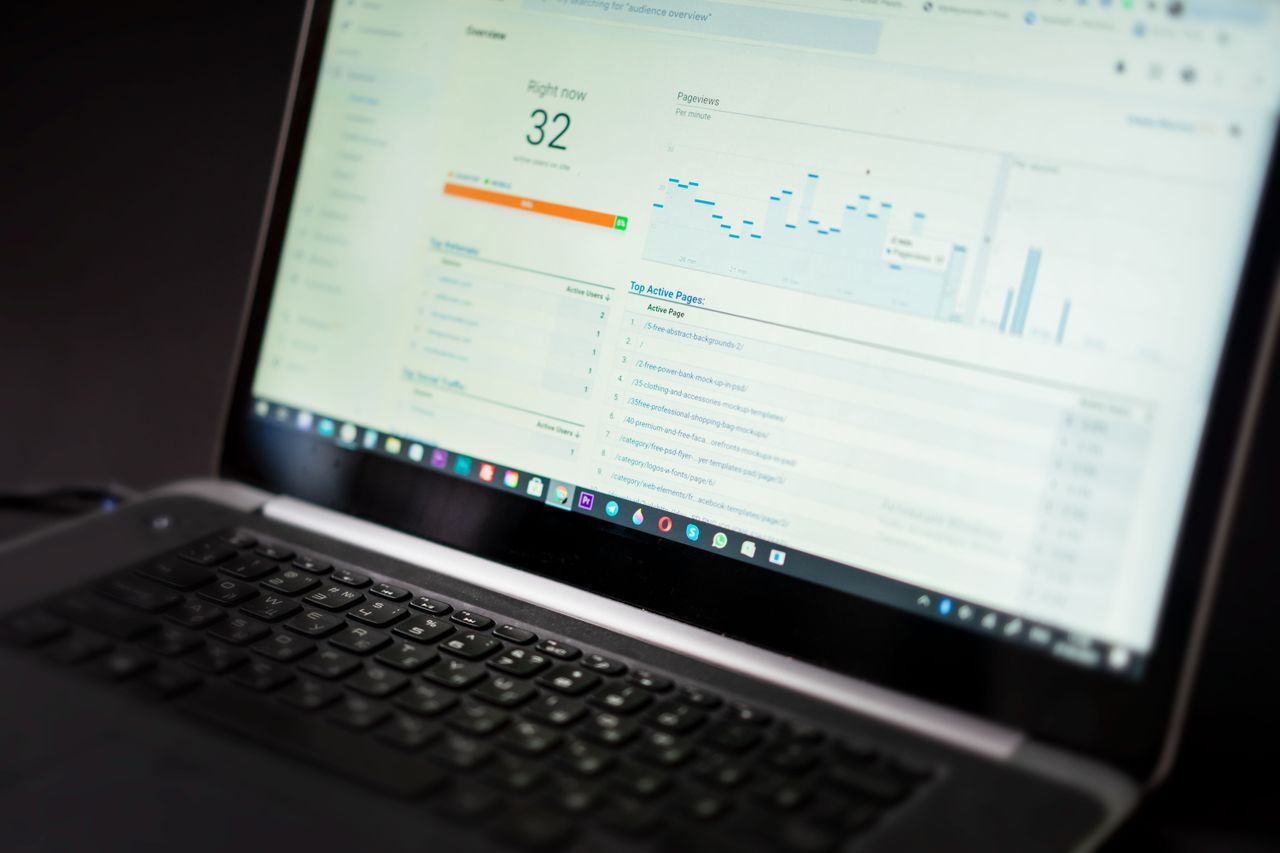 services-02 A laptop displaying an analytics dashboard with real-time data tracking and analysis tools.