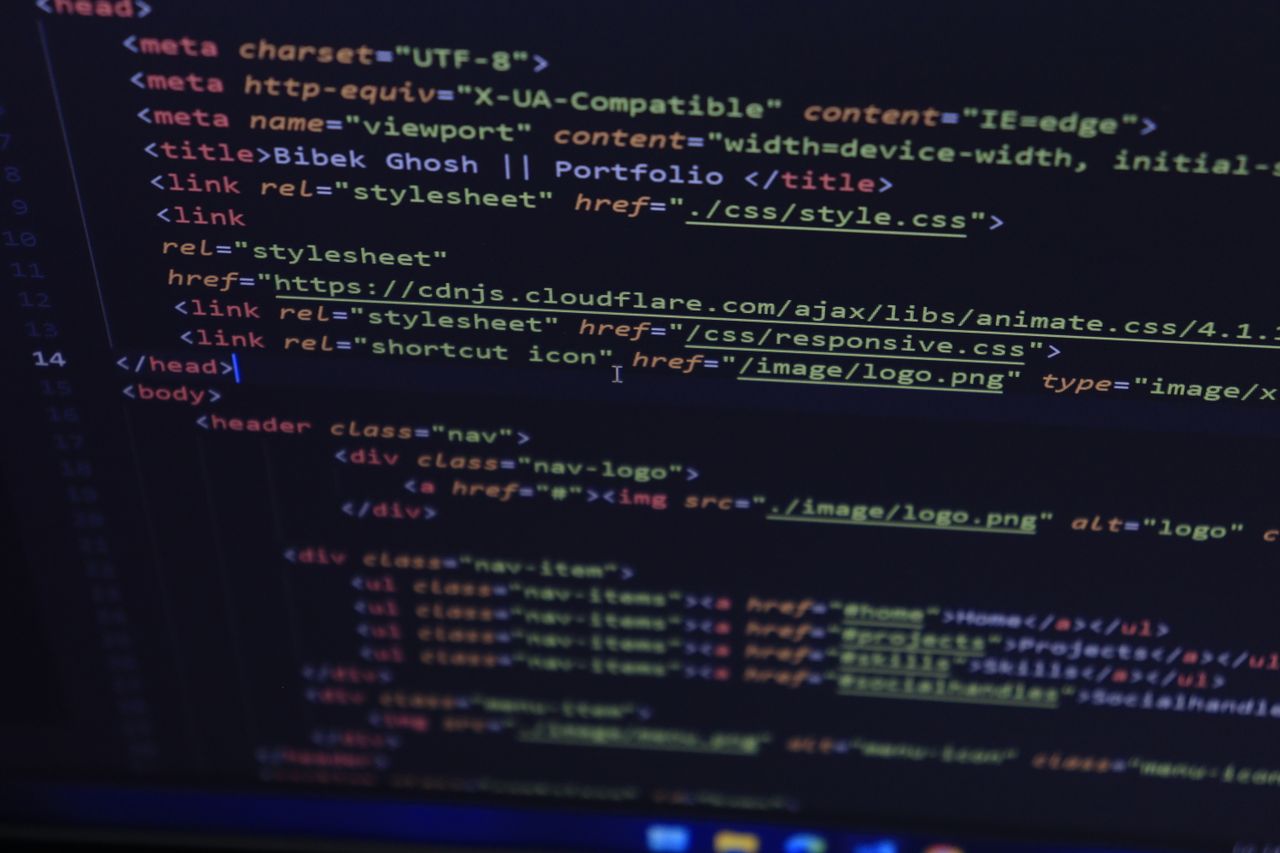 The Art of Drawing Readers In: Your attractive post title goes here Close-up of HTML and CSS code displayed on a computer screen, ideal for tech and programming themes.