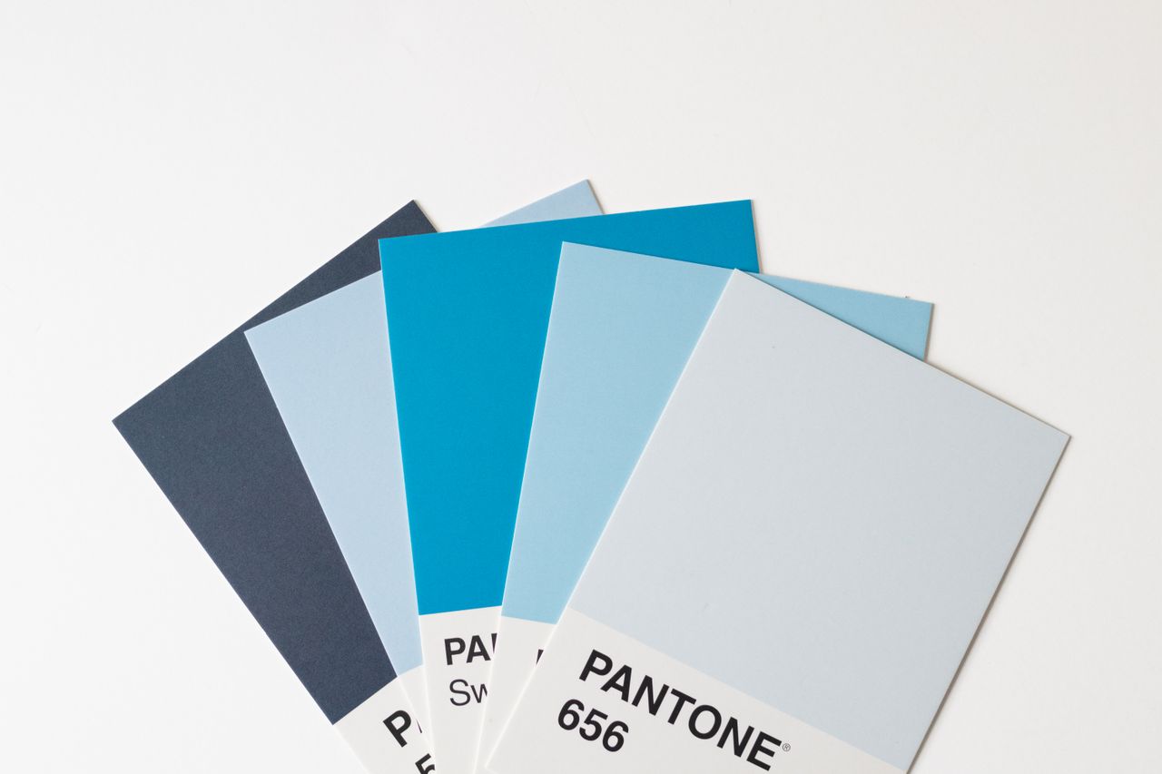 get-in-touch A collection of blue Pantone color swatches arranged on a white background for design inspiration.