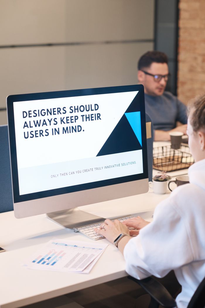 Crafting Captivating Headlines: Your awesome post title goes here A focused designer works on a user-centric project in a modern office environment.